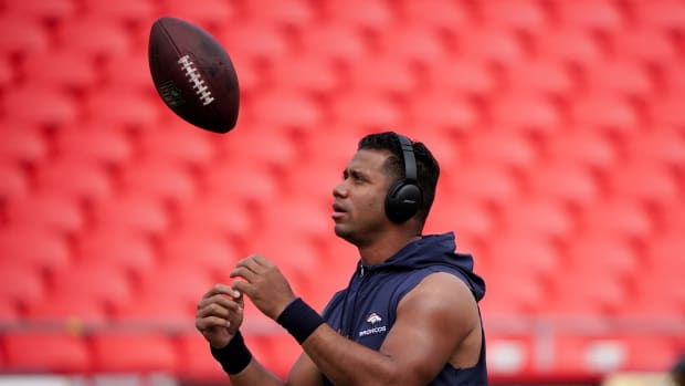 Oct 12, 2023; Kansas City, Missouri, USA; Denver Broncos quarterback Russell Wilson (3) tosses a football on field prior to a game against the Kansas City Chiefs at GEHA Field at Arrowhead Stadium. Mandatory Credit: Denny Medley-USA TODAY Sports